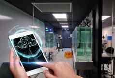 手触碰屏幕移动电话实验室显示未来主义的技术手指攻丝手机内部房间展示现代自动化标志