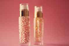 护肤品产品粉红色的背景美化妆品古董效果