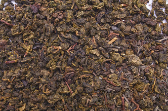 牛奶乌龙茶茶白色背景特写镜头干乌龙茶茶叶子背景发酵中国人茶拍摄