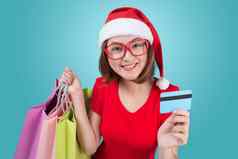 圣诞老人亚洲女人持有购物袋信贷卡蓝色的装饰图案