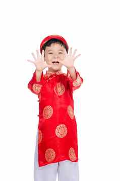 肖像英俊的亚洲婴儿男孩传统的节日服装可爱的越南男孩戴曼菊衣服微笑