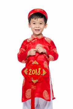 可爱的越南男孩红色的戴曼菊衣服微笑泰特假期
