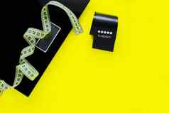 重量规模黑色的健身磁带黄色的测量磁带谎言