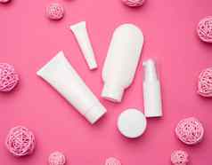 Jar瓶空白色塑料管化妆品粉红色的背景包装奶油过来这里血清广告产品促销活动模拟