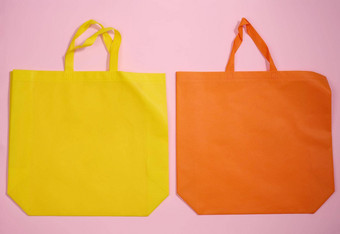 空粘胶生态友好的帆布<strong>手提</strong>包袋品牌粉红色的背景清晰的可重用的袋<strong>食品</strong>杂货模拟平躺