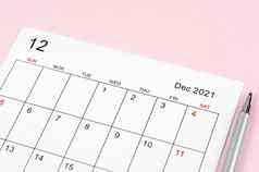 12月日历表笔粉红色的背景