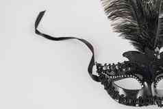 黑色的狂欢节面具羽毛表格高质量照片