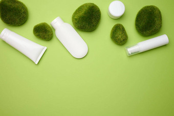 Jar瓶空白色塑料管化妆品绿色背景包装奶油过来这里血清广告产品促销活动模拟