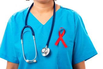 女人护士诊所统一的支持艾滋病毒艾滋病意识红色的丝带