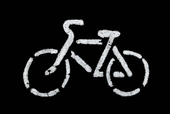 自行车标志沥青白色油漆孤立的黑色的背景