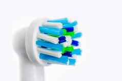 关闭电牙刷白色背景头牙刷口服卫生牙科概念健康的清洁牙齿