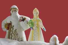 传统的符号俄罗斯一年圣诞老人老人雪少女古董圣诞节玩具红色的背景大气童年一年的奇迹