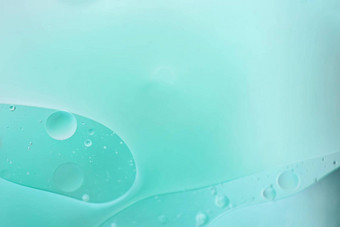 光蓝色的摘要背景图片使石油水肥皂