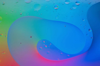 彩虹摘要散焦背景图片使石油水肥皂