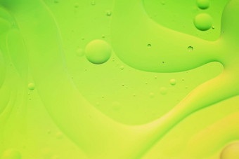 绿色黄色的摘要背景图片使石油水肥皂