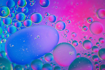 散焦粉红色的蓝色的摘要背景图片使石油水肥皂