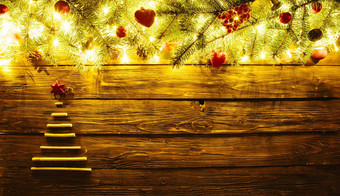 模糊圣诞节背景冷杉分支机构圣诞节树干棒仙女灯圣诞节装饰棕色（的）木板材