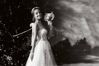 肖像优雅的新娘白色衣服花束自然自然公园模型婚礼衣服手套花束白俄罗斯