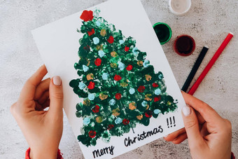 Diy使问候卡手工<strong>制作</strong>的工艺品假期孩子们油漆手指快乐圣诞节树一步一步快乐一年圣诞节树装饰