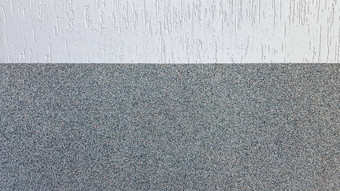 灰色的大理石芯片装饰光粉刷墙划分水平行建筑外观背景粉刷纹理街