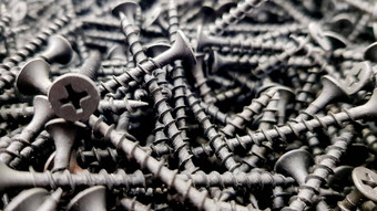 钢螺丝金属螺杆铁螺杆螺丝背景木螺杆铁金属螺杆指甲堆栈工业建筑行业背景