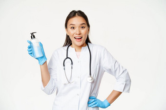 热情的女医生统一的显示手肥皂洗手液科维德预防站白色背景