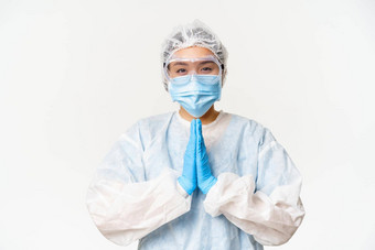 接种疫苗微笑亚洲女医生护士个人保护设备显示求手势站白色背景