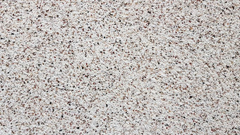 颗粒状的表面纹理建筑外观细粒度的石膏砂岩纹理背景细节前视图桑迪海滩背景复制空间可见沙子纹理