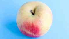 美丽的开胃的新鲜的苹果蓝色的背景健康的甜蜜的食物概念
