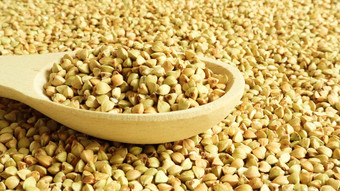 荞麦分散背景生绿色麦片木勺子健康的燕麦有机生他们素食者食物概念健康的平衡饮食饮食产品健康的燕麦