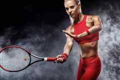 美丽的金发女郎体育运动女人网球球员球拍红色的服装