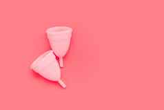 粉红色的月经杯颜色背景女亲密的卫生期产品前视图