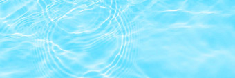 表面灯蓝色的透明的游泳池水纹理时尚的摘要波浪背景水波阳光复制空间长横幅