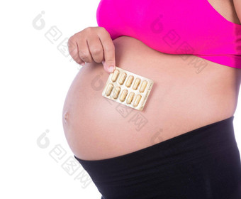 怀孕了女人包药片手白色背景