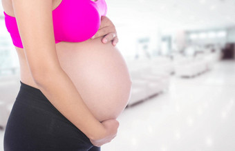 特写镜头怀孕了女人肚子手医院背景