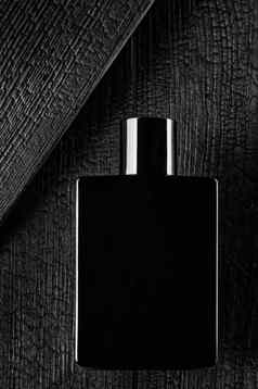 促销照片水厕所香水黑暗风格黑色的瓶背景烧树
