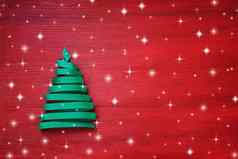 圣诞节树使丝带红色的背景复制空间