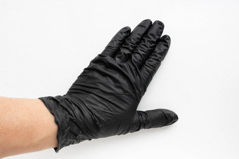 手黑色的外科手术<strong>医疗</strong>手套孤立的白色背景<strong>生产</strong>橡胶保护手套卫生卫生标准