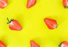 草莓模式关闭明亮的模式新鲜的减少一半草莓背景前视图平躺