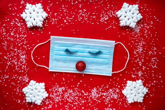 保护医疗脸面具眼睛红色的鼻子圣诞节雪花红色的背景