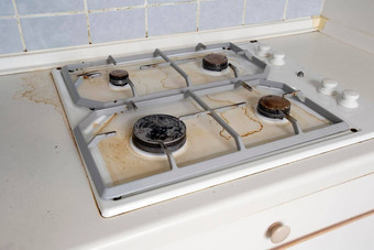 脏气体炉子烹饪石油污渍气体炉子厨房不洁净的脏厨房烹饪食物准备餐清洁关闭