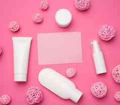 空纸卡瓶空白色塑料管化妆品粉红色的背景包装奶油过来这里血清广告产品促销活动