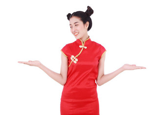 女人穿<strong>红色</strong>的<strong>旗袍</strong>开放手棕榈概念快乐中国人一年