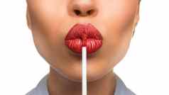 女人应用唇光泽嘴唇白色背景接吻