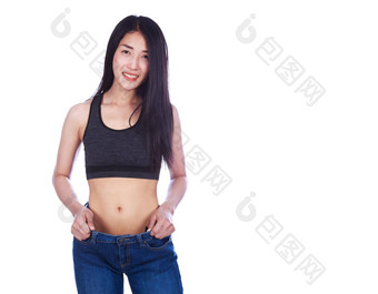 女人显示重量损失穿牛仔裤孤立的白色背景