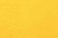 高决议关闭明亮的黄色的感觉织物纹理粗糙的羊毛织物黄色的颜色背景壁纸强烈的金一块变形感觉织物粗糙的触摸