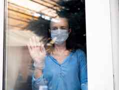 女人脸病毒面具站窗口玻璃放触碰手伤心