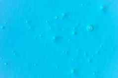 纹理透明的防腐剂过来这里空气泡沫光蓝色的单色背景