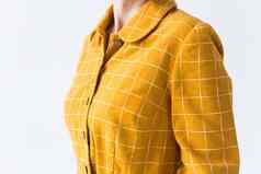 服装设计师裁缝概念前部分黄色的衣服白色背景