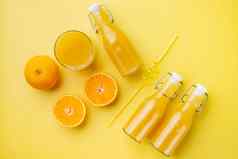 新鲜的橙色汁黄色的变形夏天背景前视图平躺